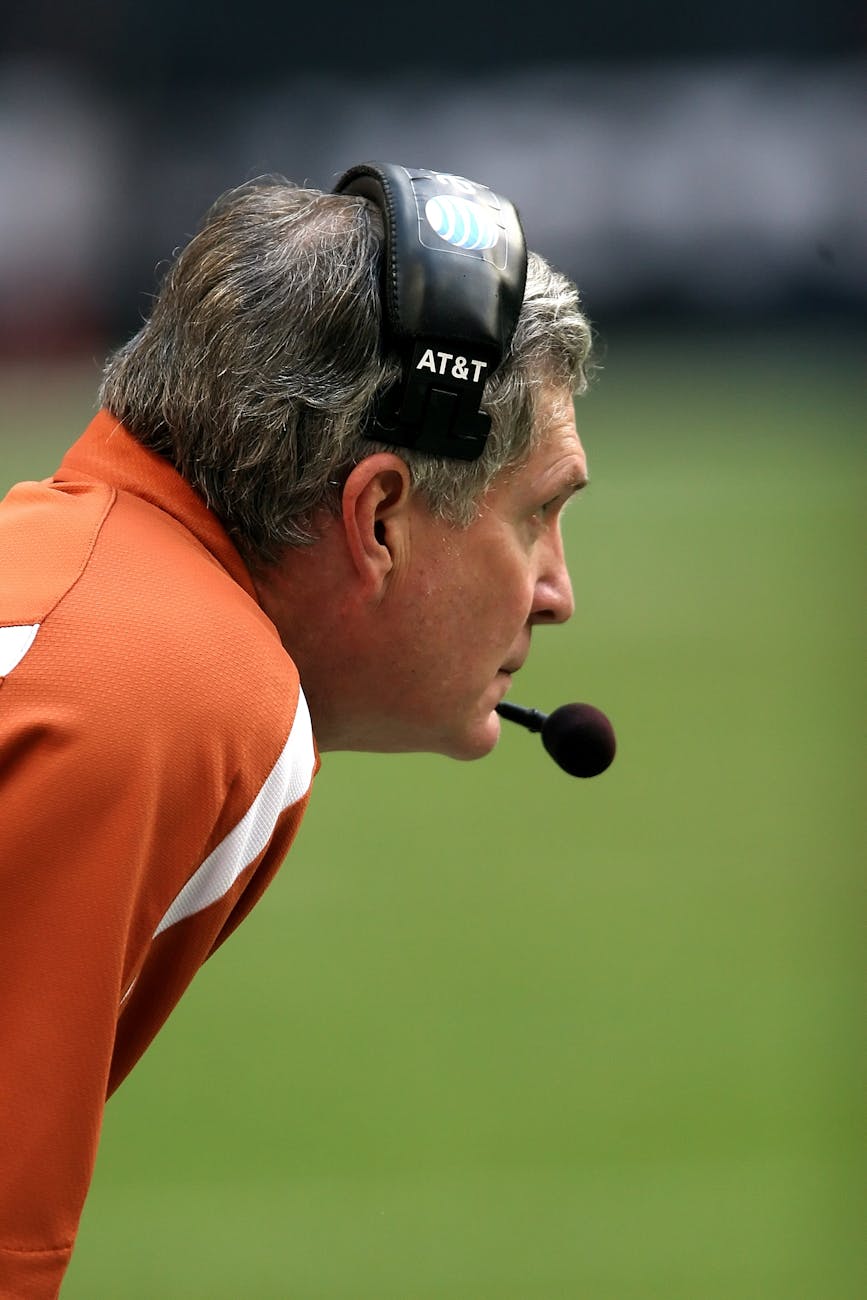 man with headset leaning forward during day