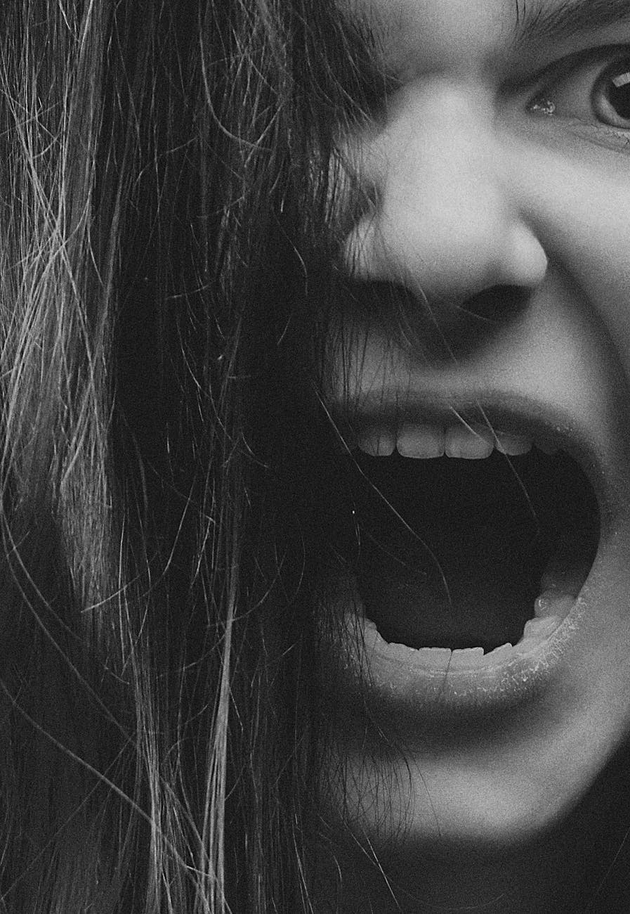 grayscale photo of an angry woman